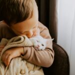 The Great Cat vs Baby Debate: Which One Wins? (Spoiler: It's Cats)
